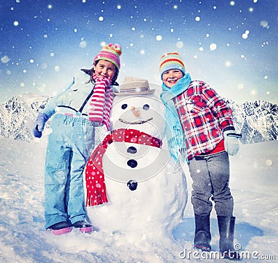 Little Girl and Boy Outdoors with Snowman Stock Photo