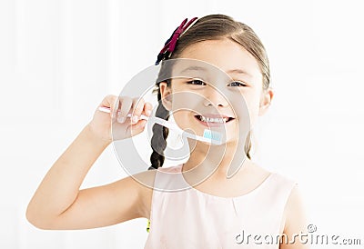 Little girl brushing her teeth Stock Photo