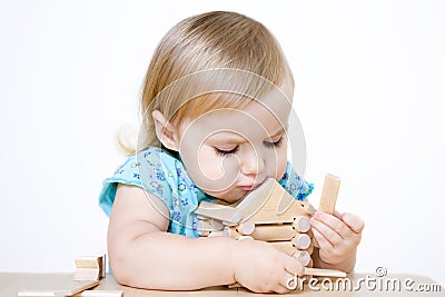 Little girl building house Stock Photo