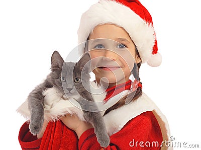 Little girl in Christmas hat with gray kitty Stock Photo