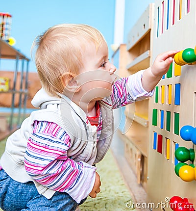 Little girl in the classroom early development Stock Photo