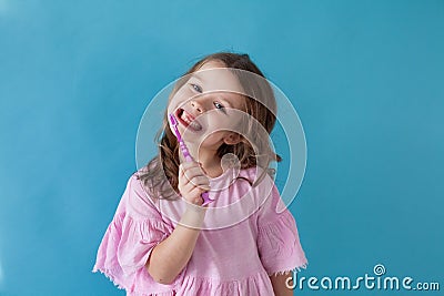 Little girl cleans teeth dentistry healthcare nice Stock Photo