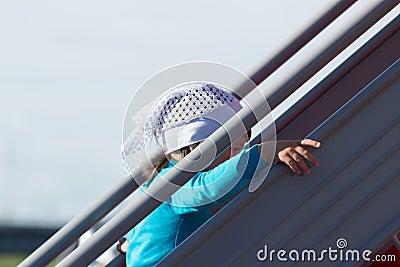 A little girl climbs the stairs Stock Photo