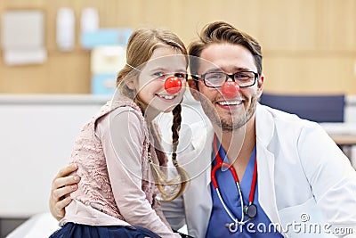 Little girl in clinic having a checkup with pediatrician Stock Photo