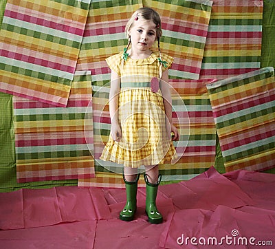 Little girl in colorful dress & boots Stock Photo