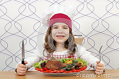 Little girl cook with big turkey drumstick Stock Photo