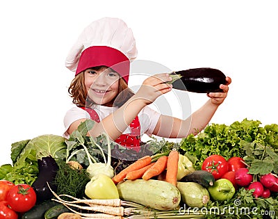 Little girl cook holding eggplant Stock Photo