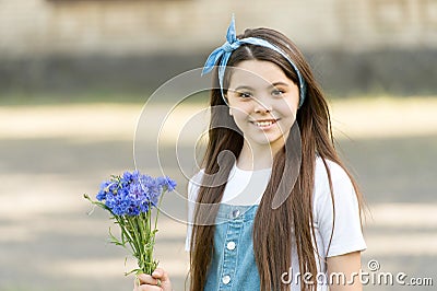 Little girl cornflowers bouquet holiday greetings, birthday gift concept Stock Photo