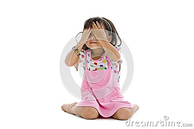 Little girl covering her eyes Stock Photo