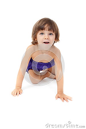 Little girl crawling on the floor Stock Photo