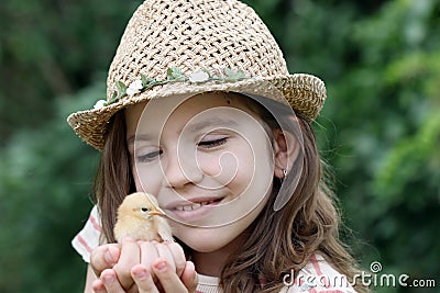 Little girl and cute yellow chicken Stock Photo