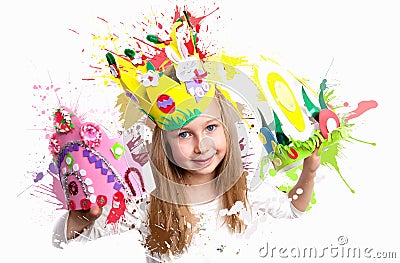 Little girl demonstrating her craft work, Easter bonnets and crown.. london Stock Photo
