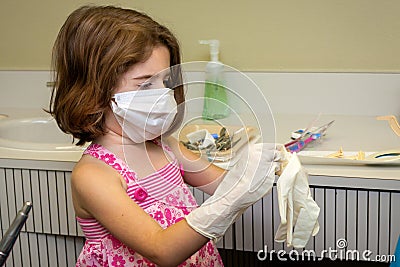 Young Dentist Preparing to Work Stock Photo