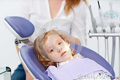 Little girl in dentist chair Stock Photo