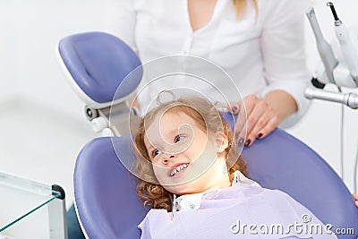 Little girl in dentist chair Stock Photo