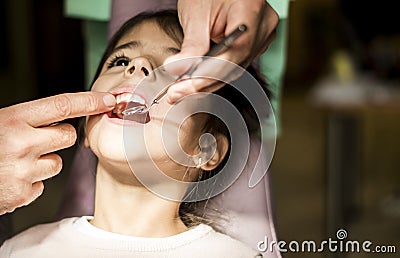 Little girl at the dentist checkup Stock Photo