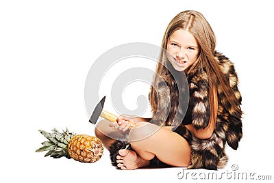 Little girl dressed in furs like prehistoric man Stock Photo