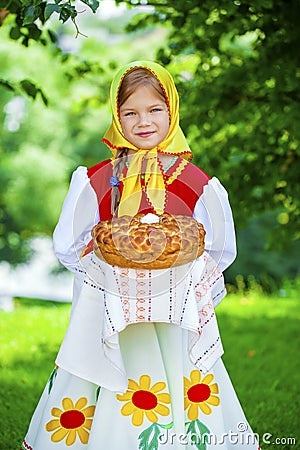 Little girl is dressed in the Russian national dress in summer p Stock Photo