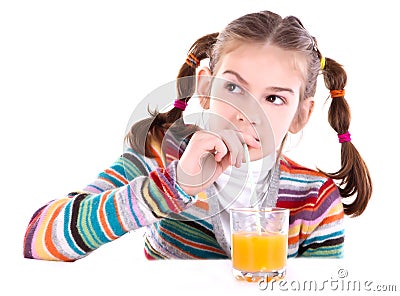 Little girl drinking orange juice Stock Photo