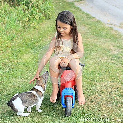 Little girl driving small kids motorbike Stock Photo