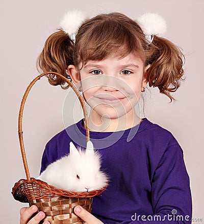 Little girl with dwarf white bunn Stock Photo