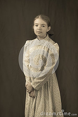 Little girl in early 20th century clothing in replica antique photograph Stock Photo