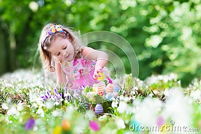 Little girl on Easter egg hunt Stock Photo