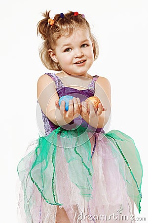 Little girl with Easter eggs in hands Stock Photo