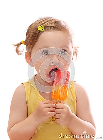 Little girl eating colorful icelolly Stock Photo