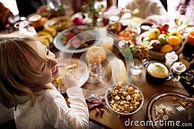 Little Girl Eating Corn Thanksgiving Celebration Concept Stock Photo