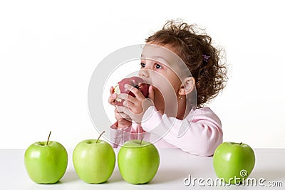 Little girl eating a red apple Stock Photo