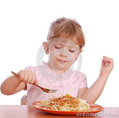 Little girl eating spaghetti Stock Photo