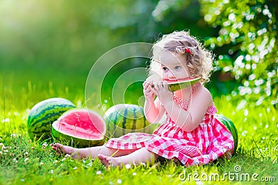 Little girl eating watermelon Stock Photo