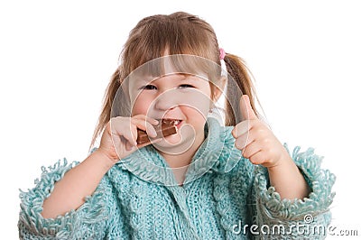 The little girl eats chocolate Stock Photo