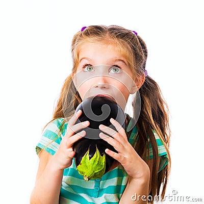 Little girl with eggplant Stock Photo