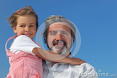 Little girl embracing grandfather Stock Photo