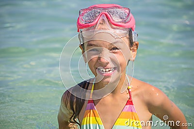 Little girl emerged in the diving mask Stock Photo