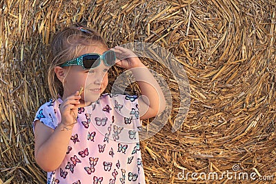 A little girl with fashion children sunglasses Stock Photo