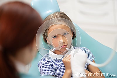 Little girl feeling scared of dental examination Stock Photo