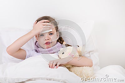 The little girl fell ill, her fever rose, she holds her hand to the sick head Stock Photo
