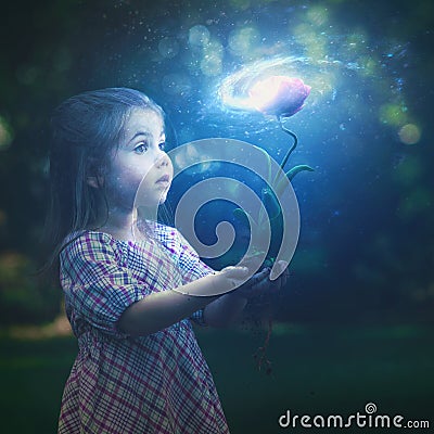 Little girl and galaxy flower Stock Photo