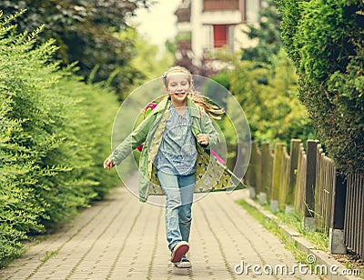 Little girl go home from school Stock Photo