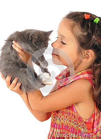 Little girl with gray kitty in hands Stock Photo