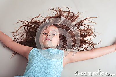 Little girl with hair all over the place Stock Photo