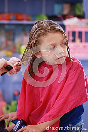 Little girl haircut Stock Photo