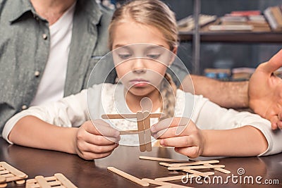 Little girl handcrafting Stock Photo