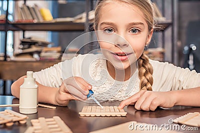 Little girl handcrafting Stock Photo