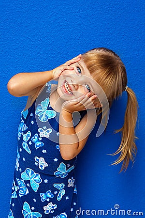 Little Girl Hands on Face Head Tilted Stock Photo