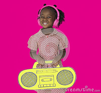 Little Girl Headphones Holding Radio. Stock Photo