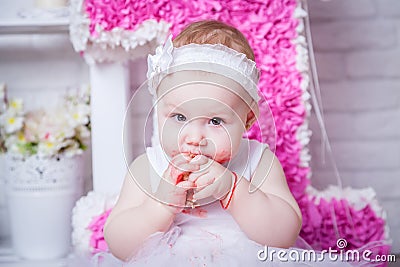 Little girl on her birthday eating cake Stock Photo